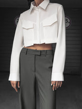 Cropped shirt with asymmetric bottom edge